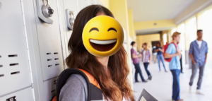 tock image of student. A laughing emoji is obscuring the student's face